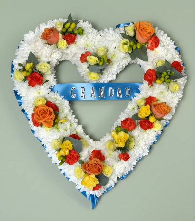 Massed Heart - A beautiful open-heart funeral tribute created to honour the memory of a beloved Grandad. Designed with a pristine white base and accented with soft, warm-toned details, this arrangement symbolises love, respect, and cherished family memories. The personalised ribbon adds a touching and meaningful element, making it a heartfelt expression of remembrance. Suitable for funeral services, memorial ceremonies, or celebrations of life, this tribute offers a lasting symbol of affection and gratitude for a much-loved grandfather.